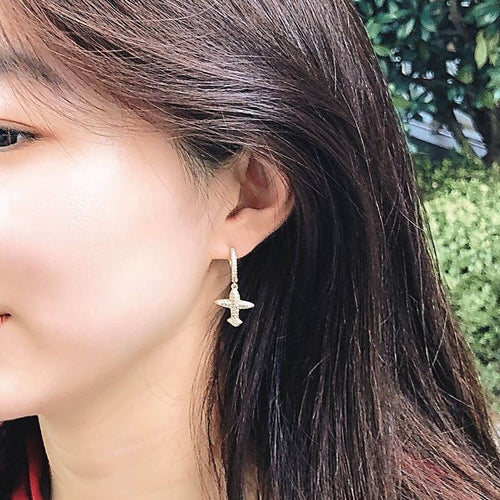 kora garro jewelry gold huggie hoop earrings plane Mila