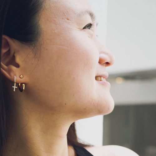 small cross hoop earrings sterling silver huggie hoops faith koragarro