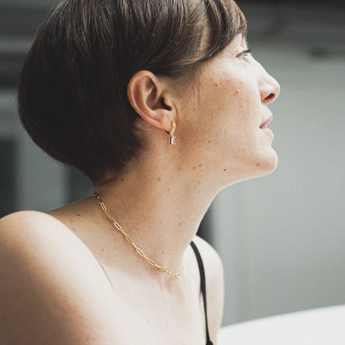 sterling silver gold huggie hoop solitary dangle earrings orla purple koragarro