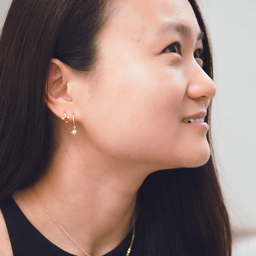 sterling silver gold star huggie earrings nova koragarro